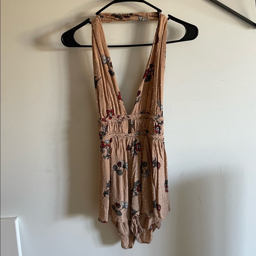 Backless mauve halter romper with floral pattern